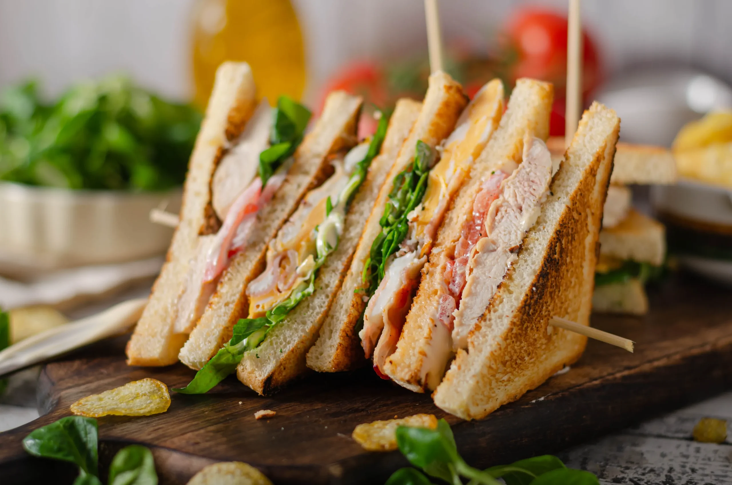 A delicious club sandwich standing.