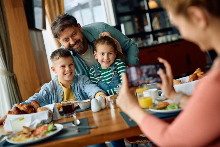 A happy family having fun on the restaurant.